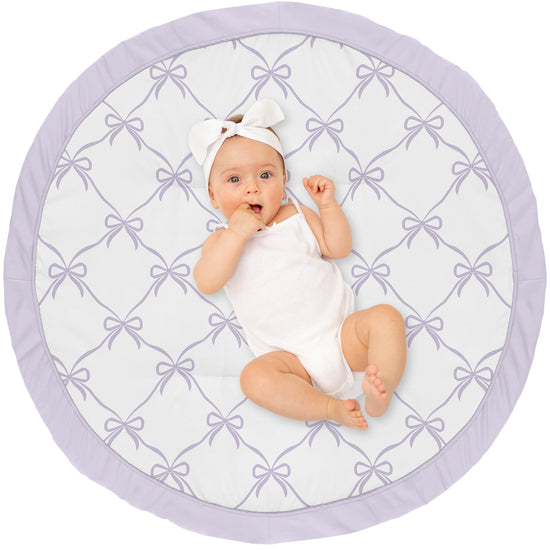 Baby lying on a round play mat 